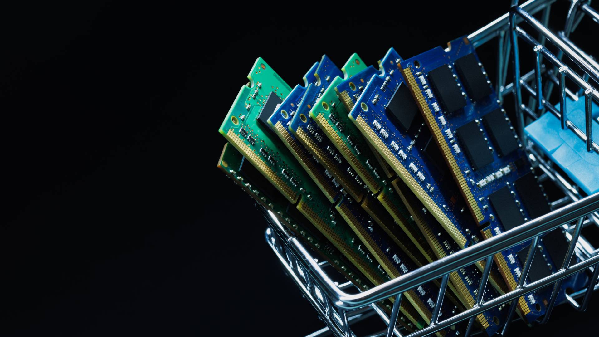 Close up view of laptop ddr memory modules in shopping cart on black background